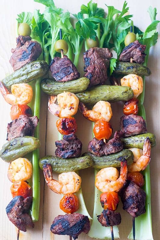 overhead view of steak kabobs with celery