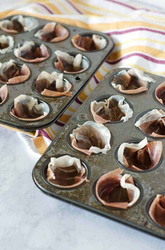 mini muffin tins lined with proscuitto