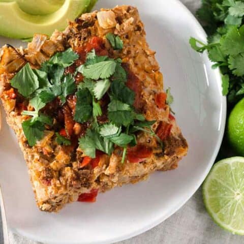 overhead view of beef taco casserole on plate with cilantro garnish