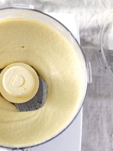 overhead view of food processor full of dairy free cheese sauce