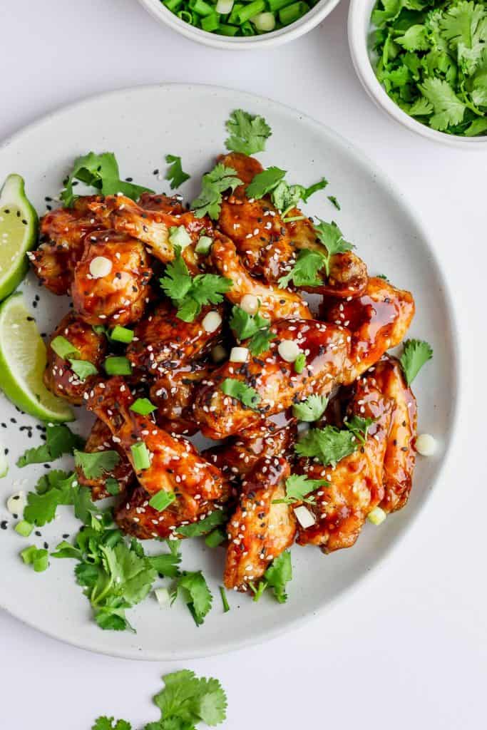 Overhead view of a plate of ginger sesame baked chicken wings