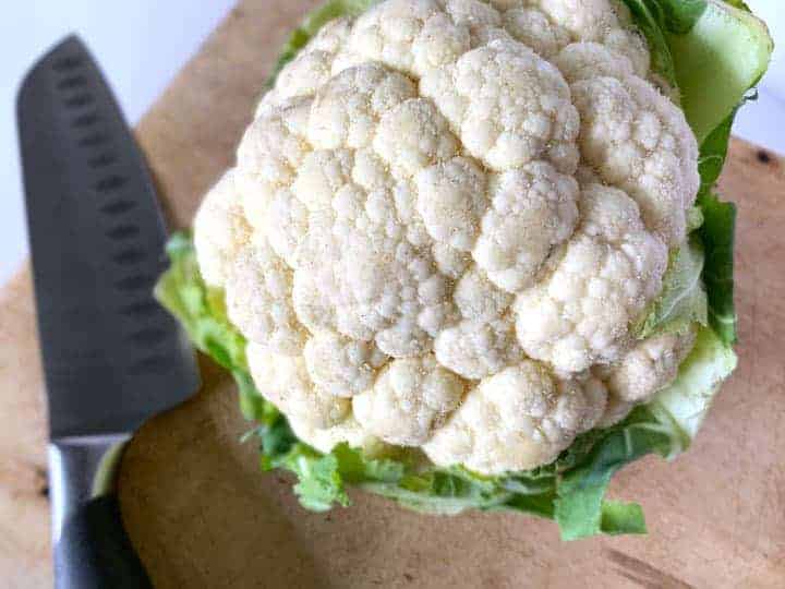 head of cauliflower on a cutting board