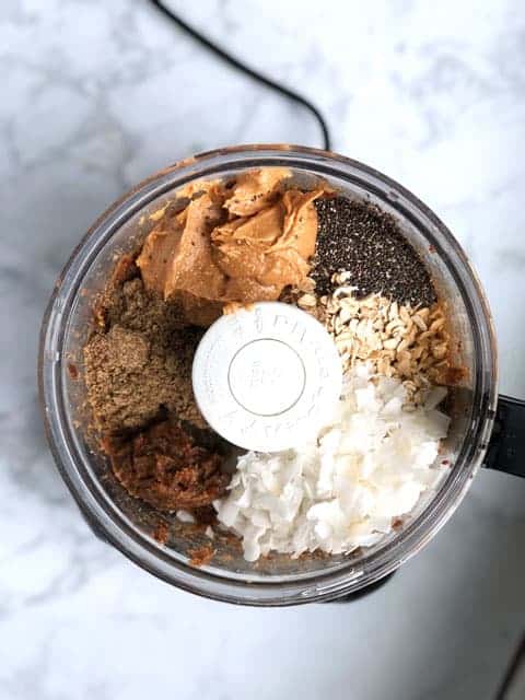 overhead view of food processor with ingredients for energy balls