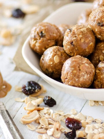 white bowl filled with cashew cranberry energy balls