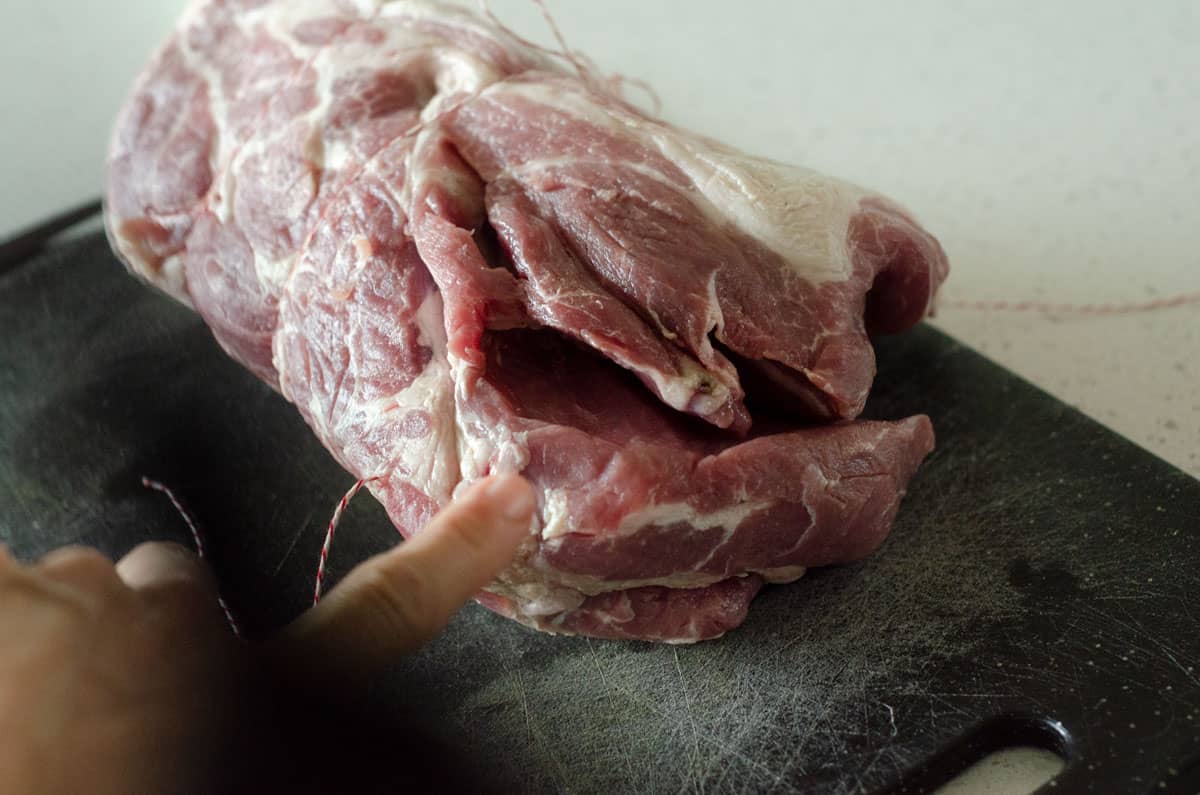 Boston butt on cutting board showing where bone was removed