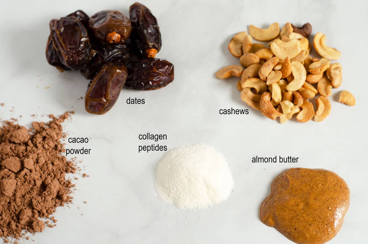 Paleo protein ball ingredients laid out on a counter with labels