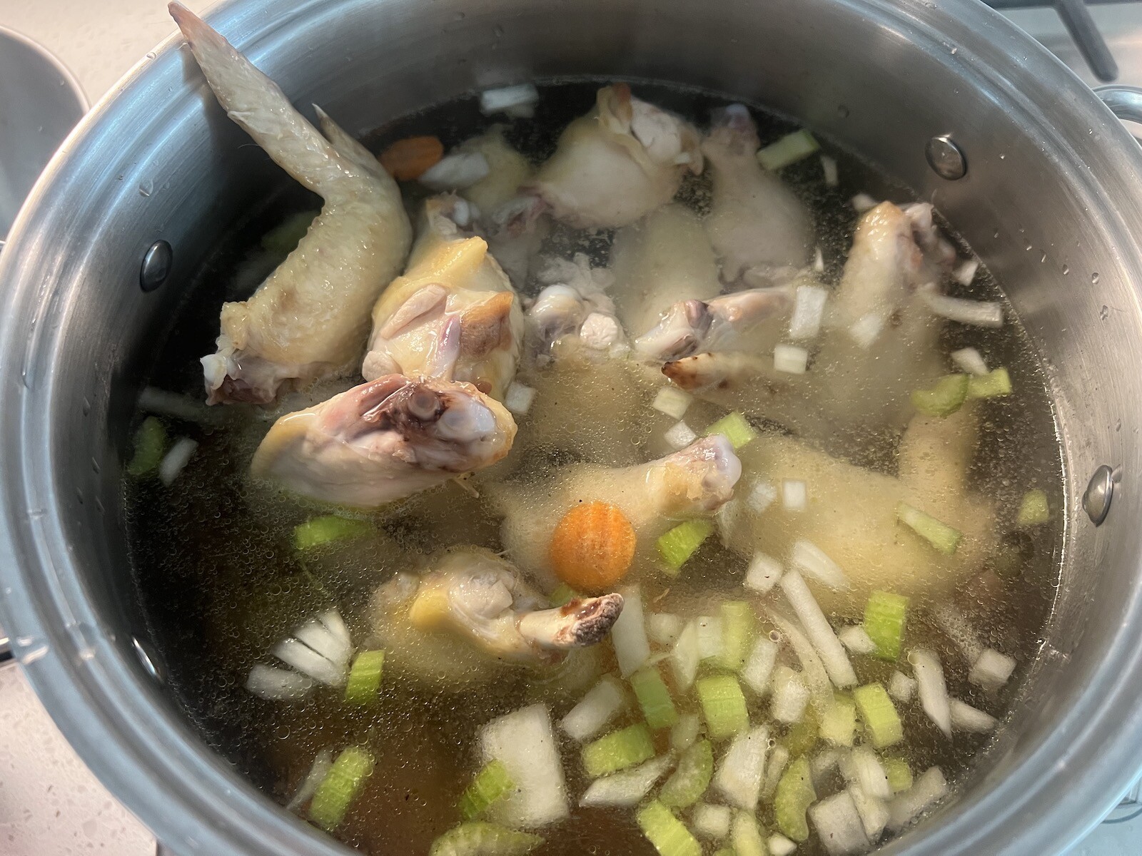 chicken souse cooking in stockpot