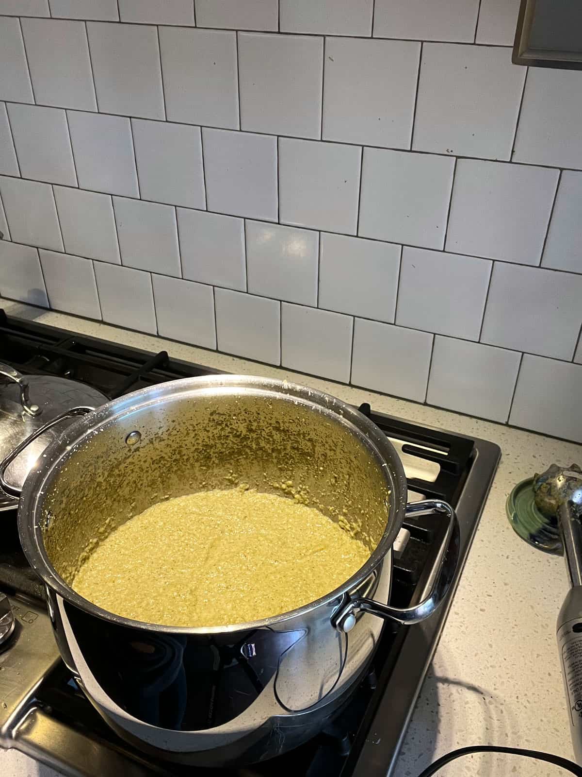 Creamy broccoli soup in stock pot on stove