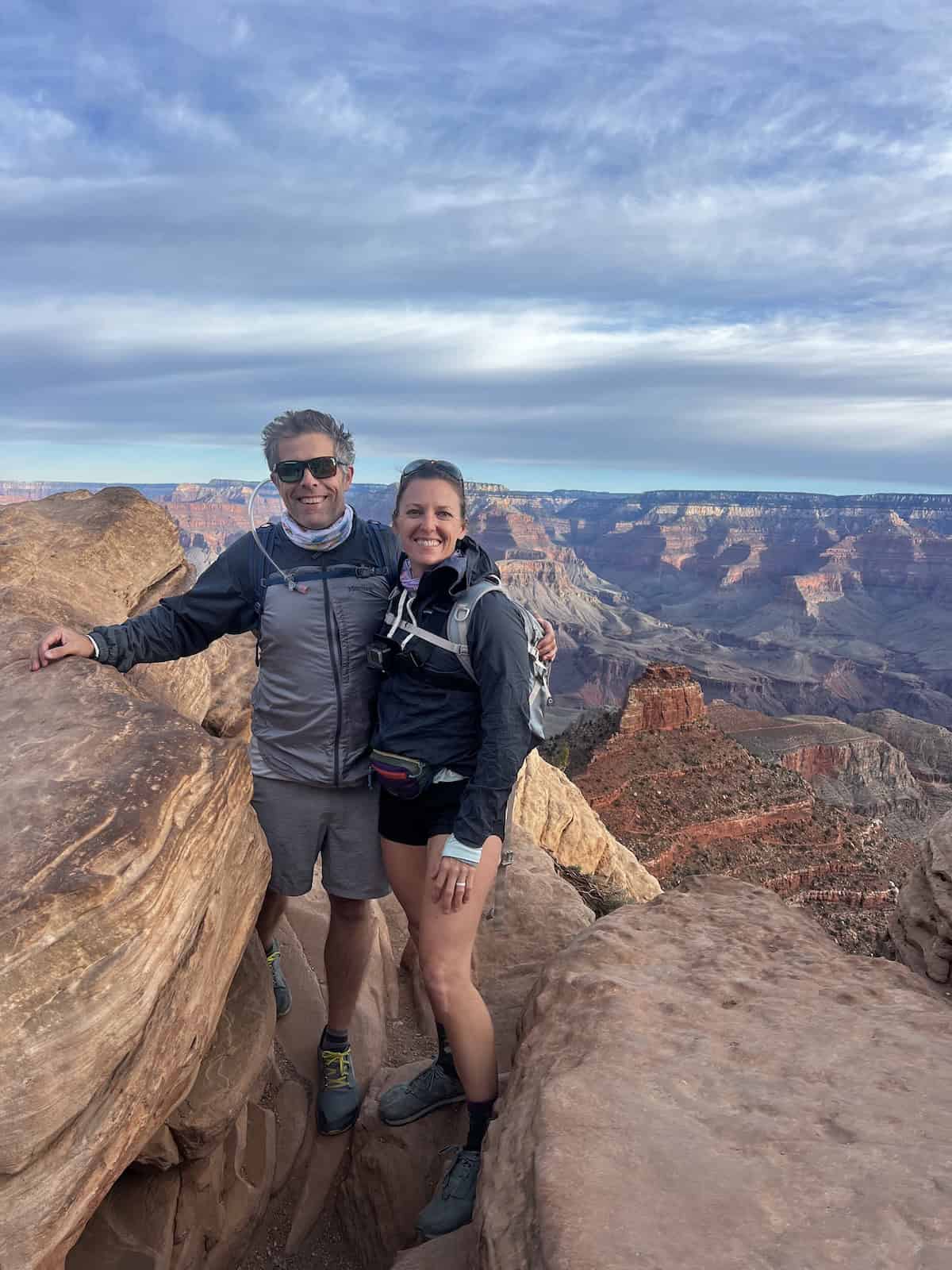 man and woman standing together at ooh ahh point on south kaibab trail grand canyon