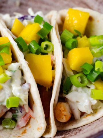 close up view of shrimp tacos in a bowl